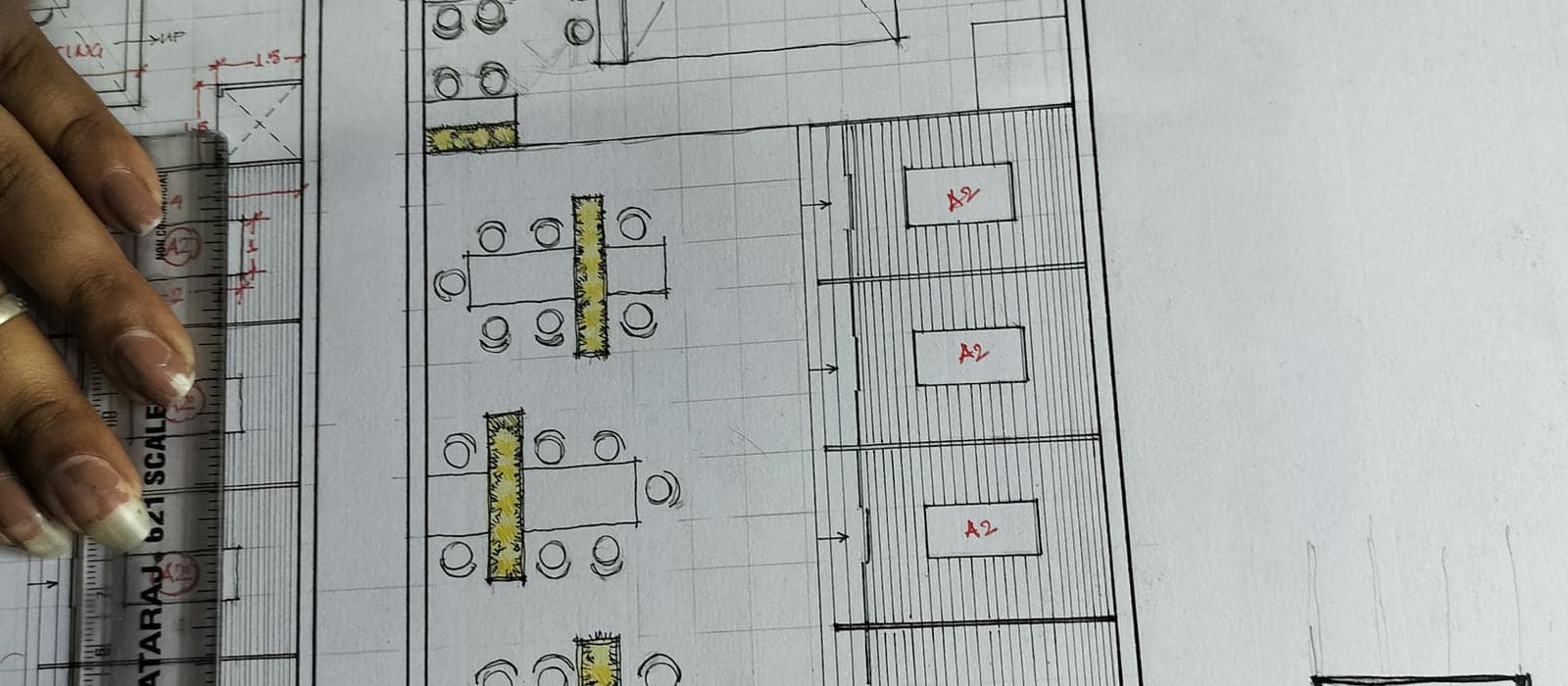 An architect drawing a floor plan, the stage at which an operable wall is easiest to get right